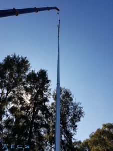 Liebherr Crane lifting 50m steel comms tower